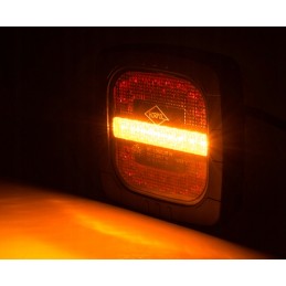 Combined rear lamp with a handle