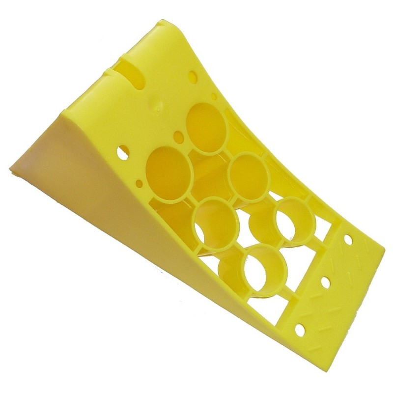 Plastic wedge under the wheel of a bus tow truck adr