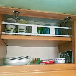 Telescopic rod for a double cabinet for a camper