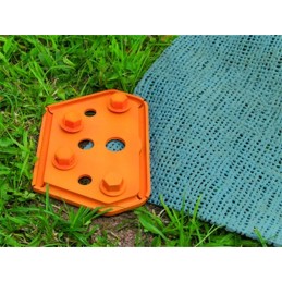 Tiles fixing the carpet floor in a peggy peg tent
