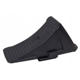 A wheel chock for a tow truck trailer and a handle