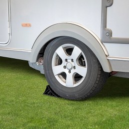 Black wheel chock with handle and mounting