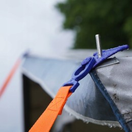 Tension belt with spring for peggy peg awning