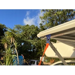 Tension belt with spring for peggy peg awning