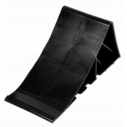 Single black tripus wheel chock for a camper