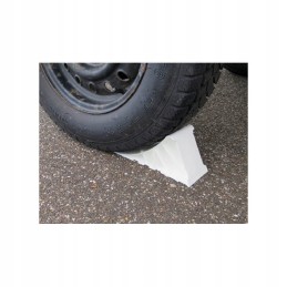 Single white tripus wheel chock for a camper