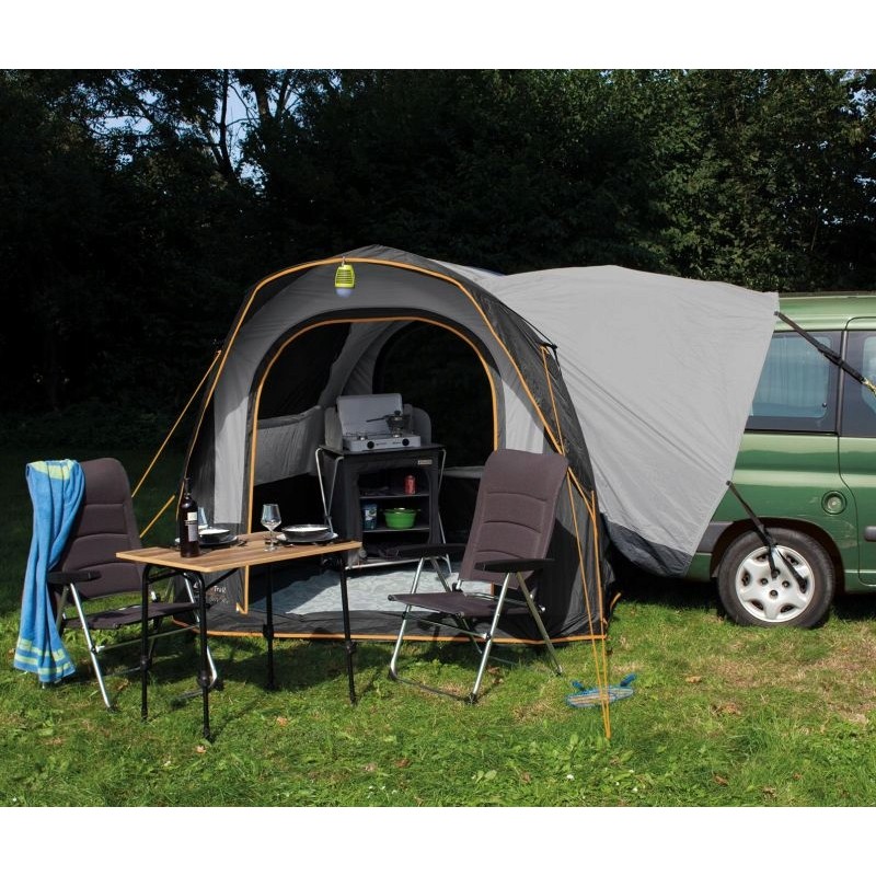 A tent inflatable on the back of an Air Eurotrail cruiser bus
