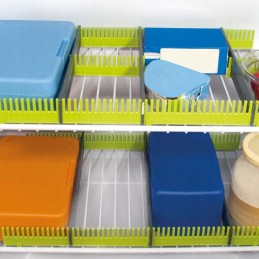 Organizer compartments for the fridge of a camper trailer